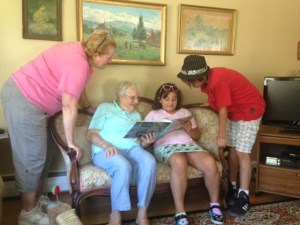 family viewing photo book